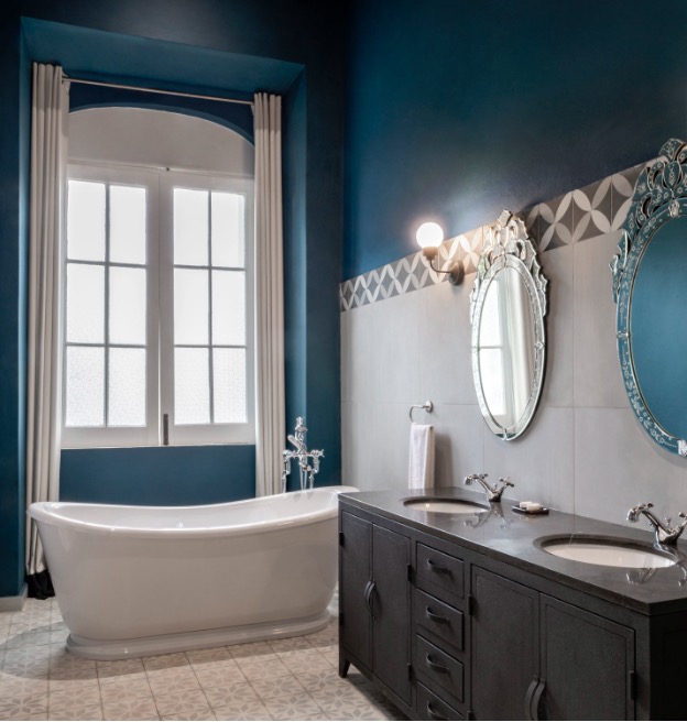 Roça Sundy suite bathroom with freestanding tub and twin vanities