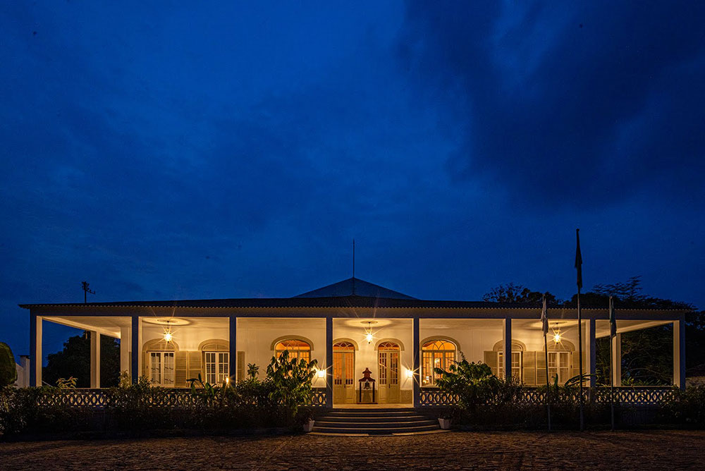 Roça Sundy heritage facade illuminated at blue hour