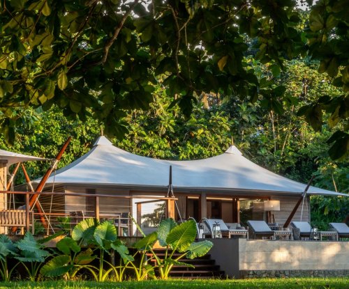 Sundy Praia Principe tented villa framed by rainforest