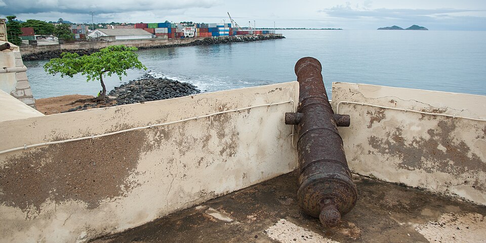Antique cannon on the ramparts of Forte de São Sebastião, overlooking the port