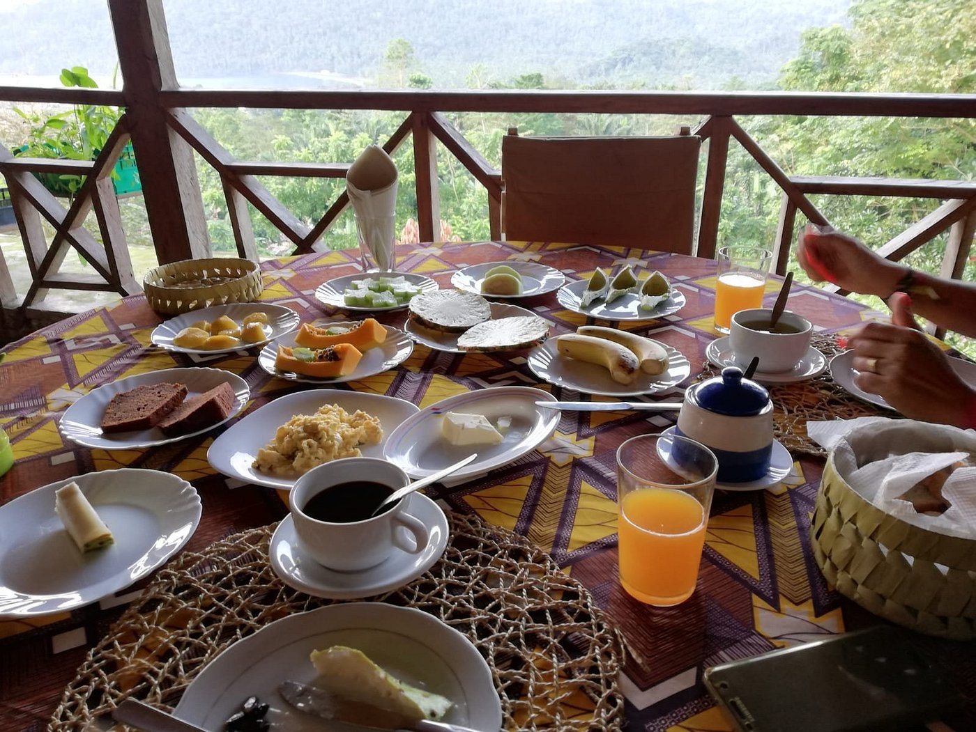 Santomean breakfast on the terrace with a forest view at Roça São João dos Angolares, São Tomé