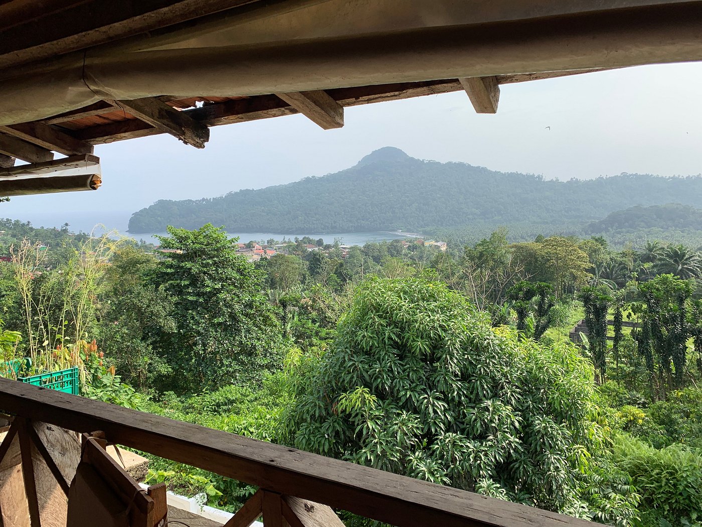 Hilltop terrace view over the bay and forested coast at Roça São João dos Angolares, São Tomé