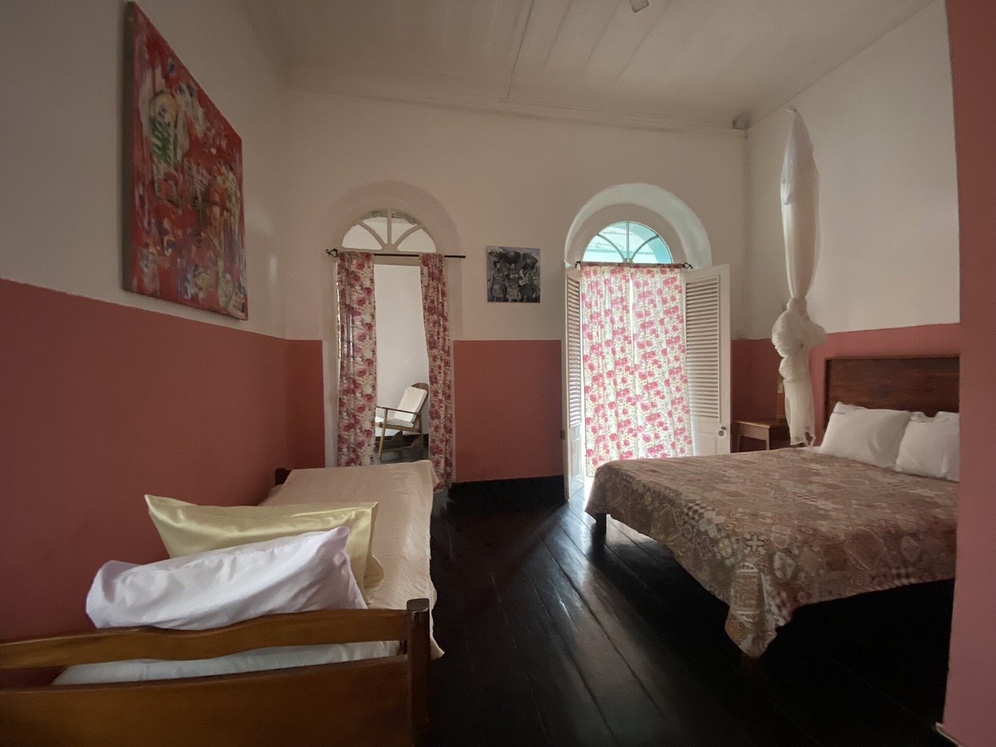 Plantation-house guest room with period furnishings at Roça São João dos Angolares, São Tomé