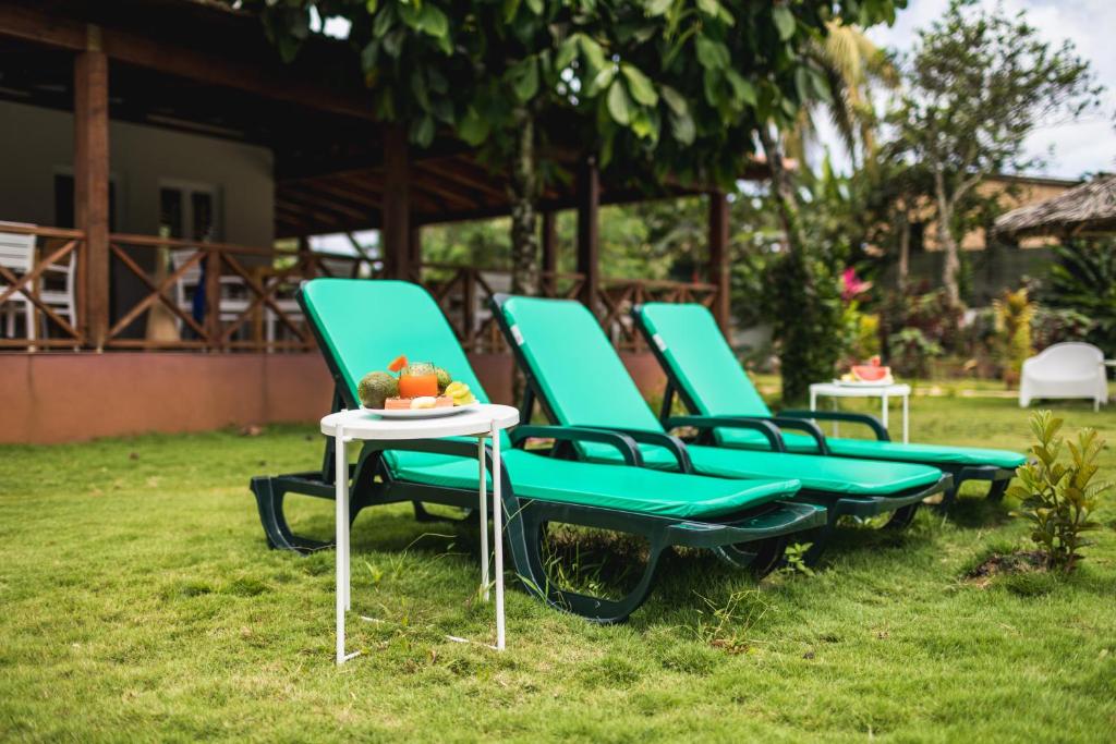 Sun loungers on the garden lawn at Roça Santo António Ecolodge, São Tomé