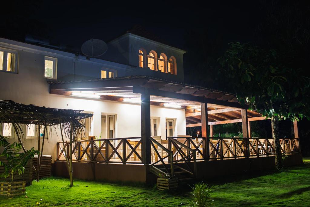 The plantation lodge illuminated at night at Roça Santo António, central São Tomé