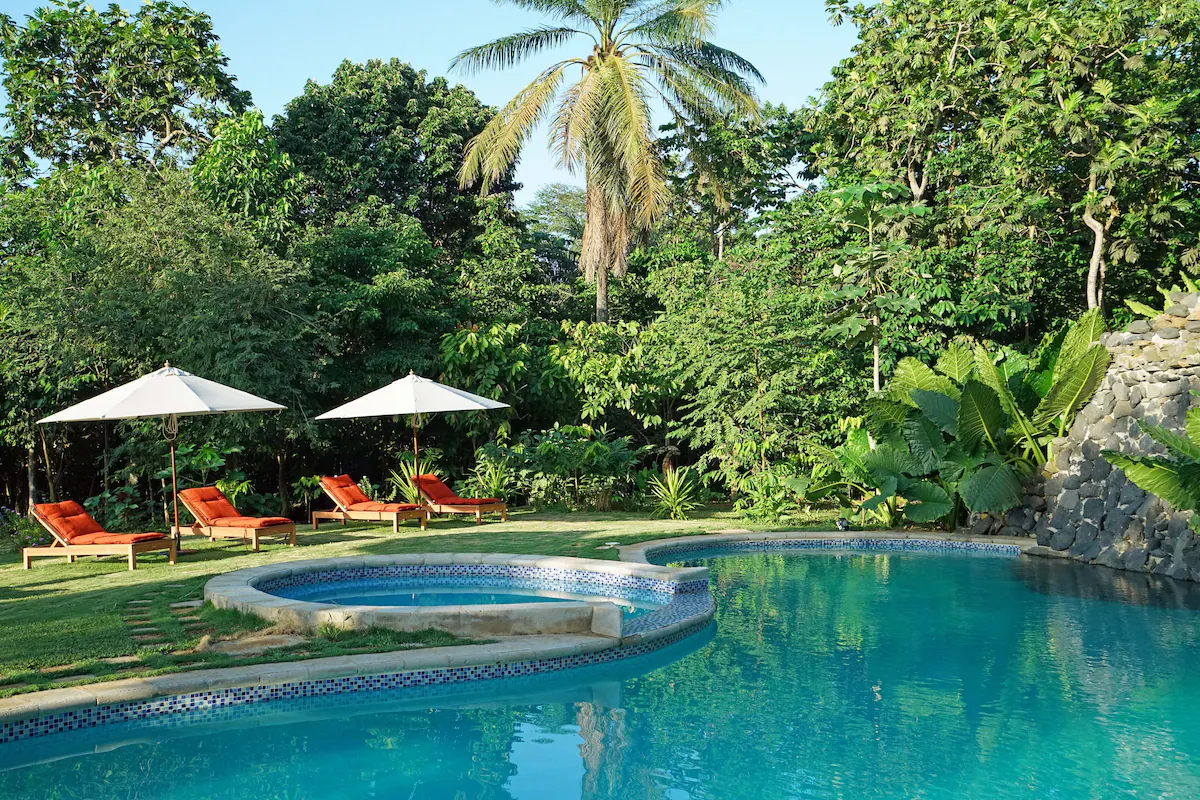 Garden pool ringed by jungle at Belo Monte, Príncipe