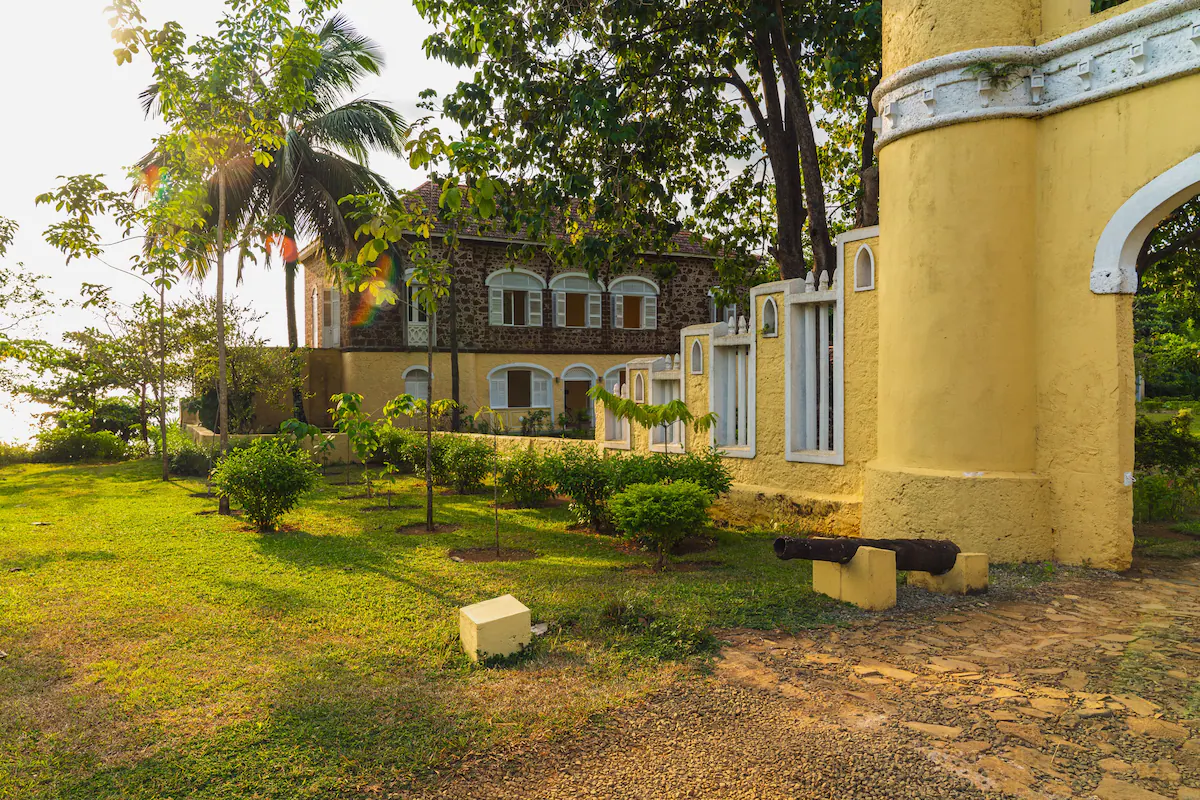 Restored plantation house and tower at Belo Monte at golden hour, Príncipe
