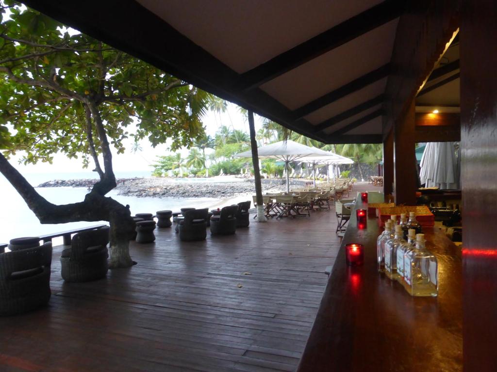 Beachfront bar and lounge deck with sea views at Club Santana, São Tomé