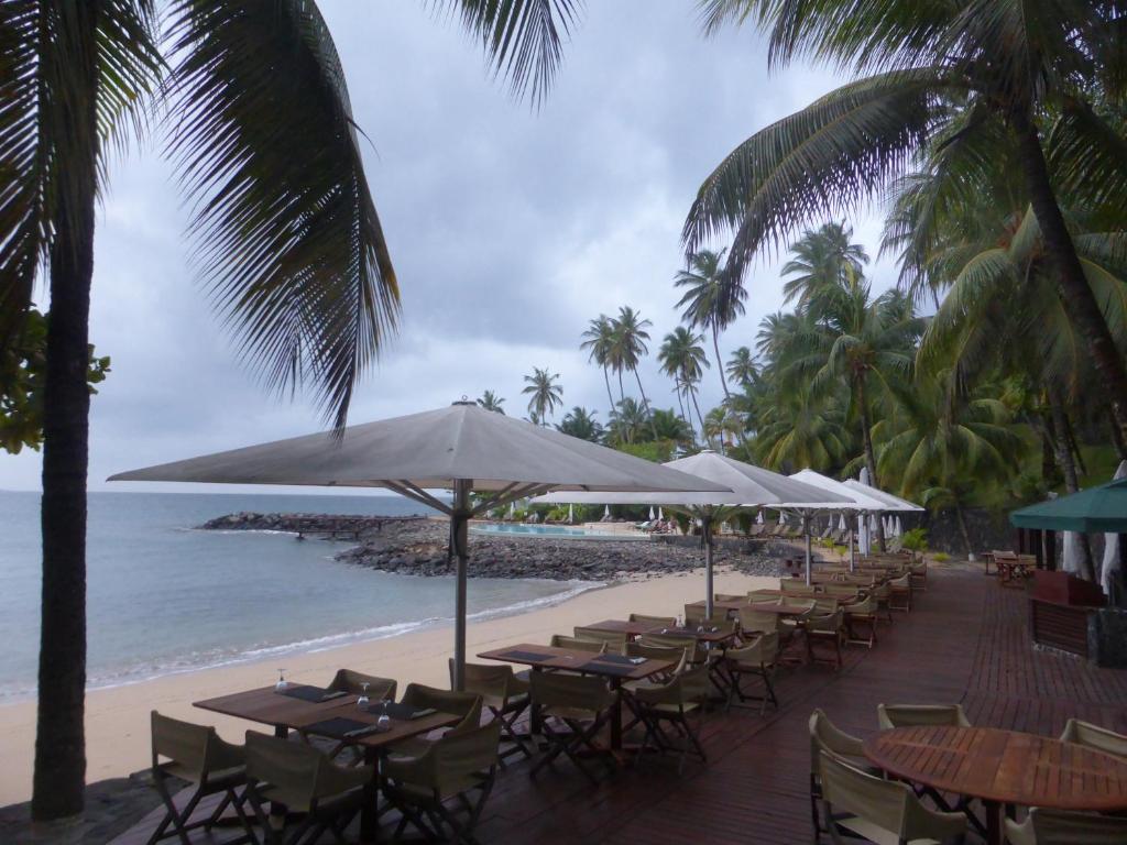 Beachfront restaurant terrace overlooking the cove at Club Santana, São Tomé
