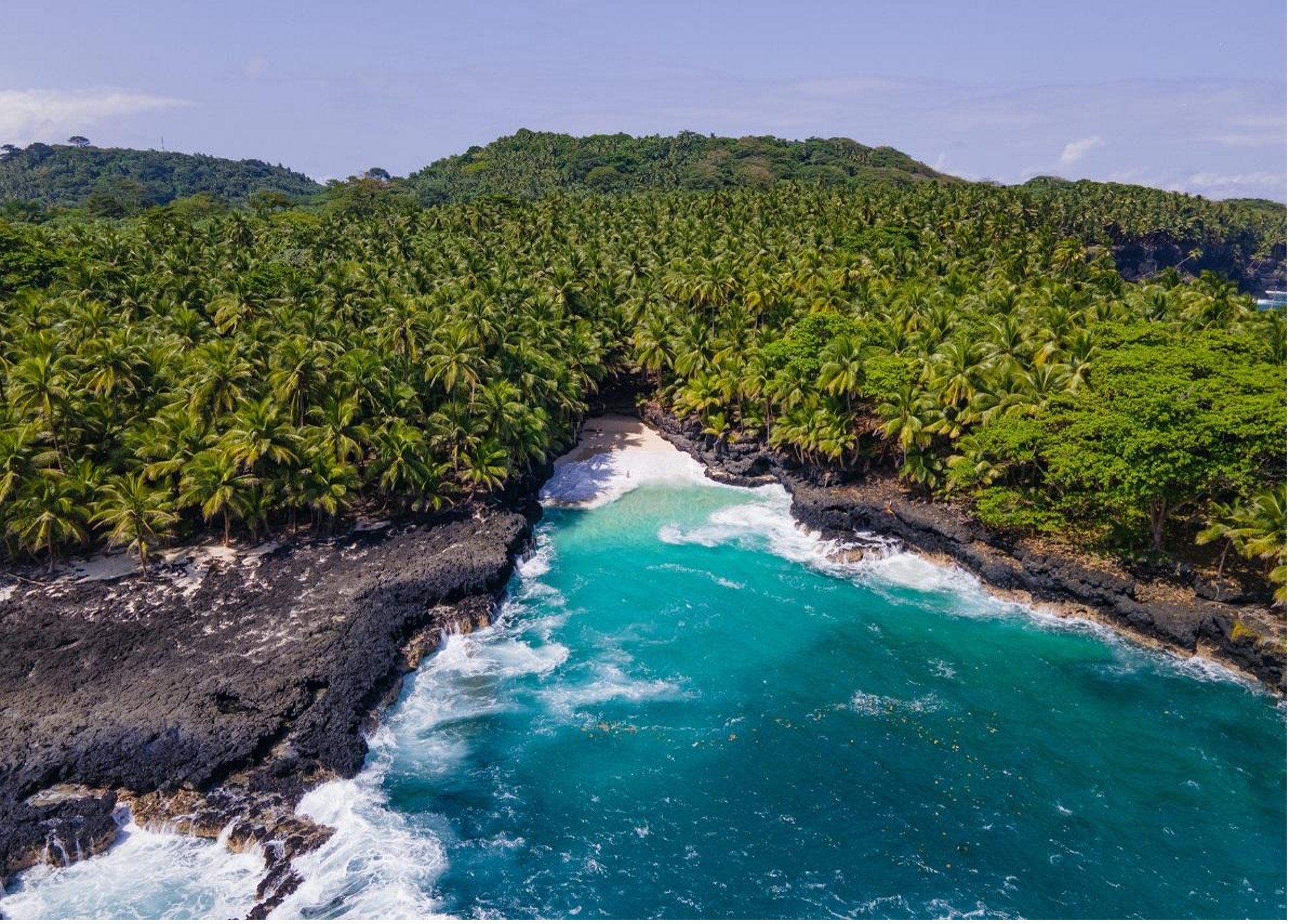 Aerial view of a cove and surf on Ilhéu das Rolas