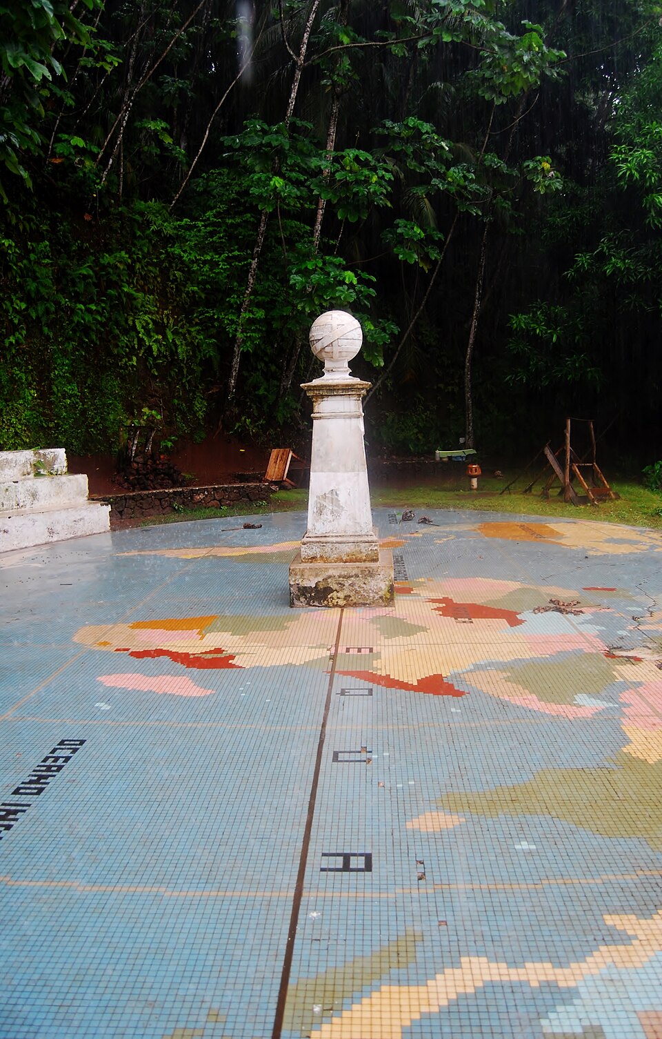 Equator monument on Ilhéu das Rolas with the tiled world map marking zero degrees latitude