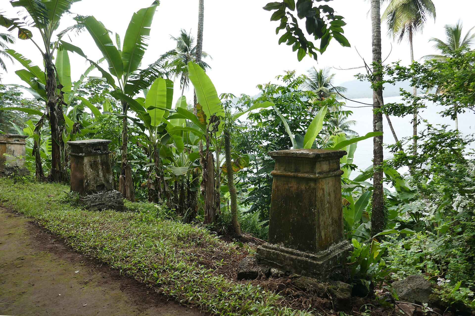 Old stone markers on the path to the Equator monument, Ilhéu das Rolas
