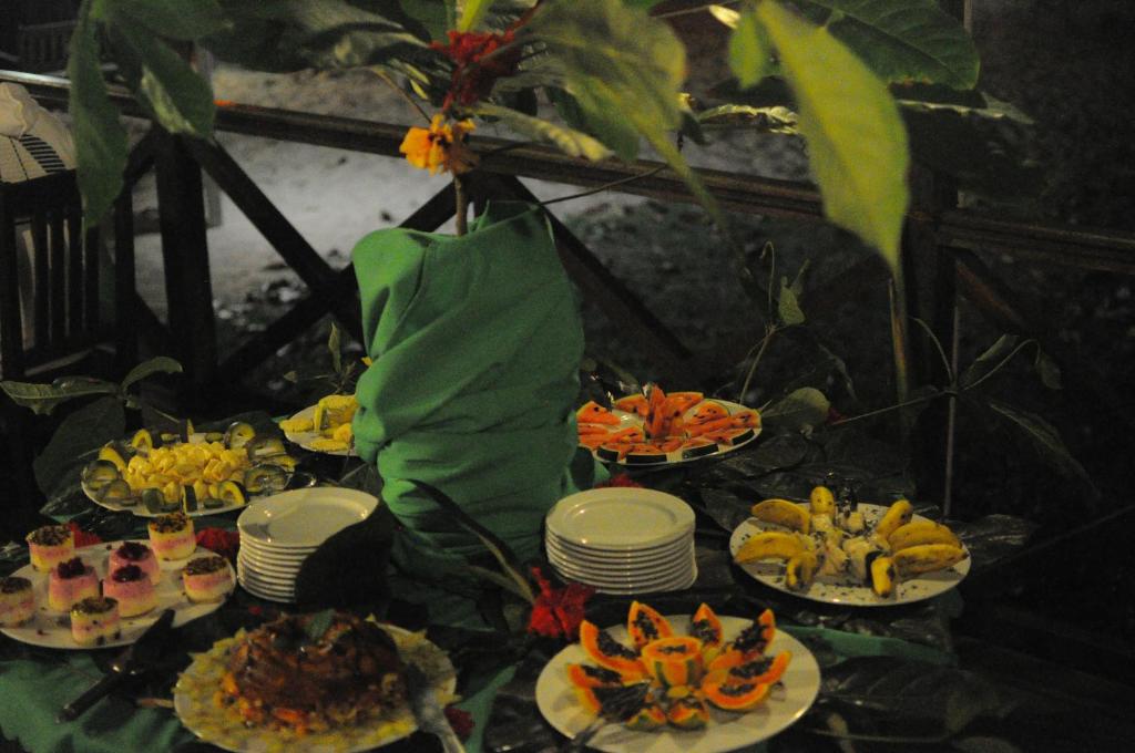 Tropical fruit and dessert spread at Praia Inhame Eco Lodge
