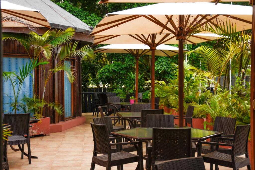 Omali Lodge garden restaurant terrace with umbrellas, São Tomé