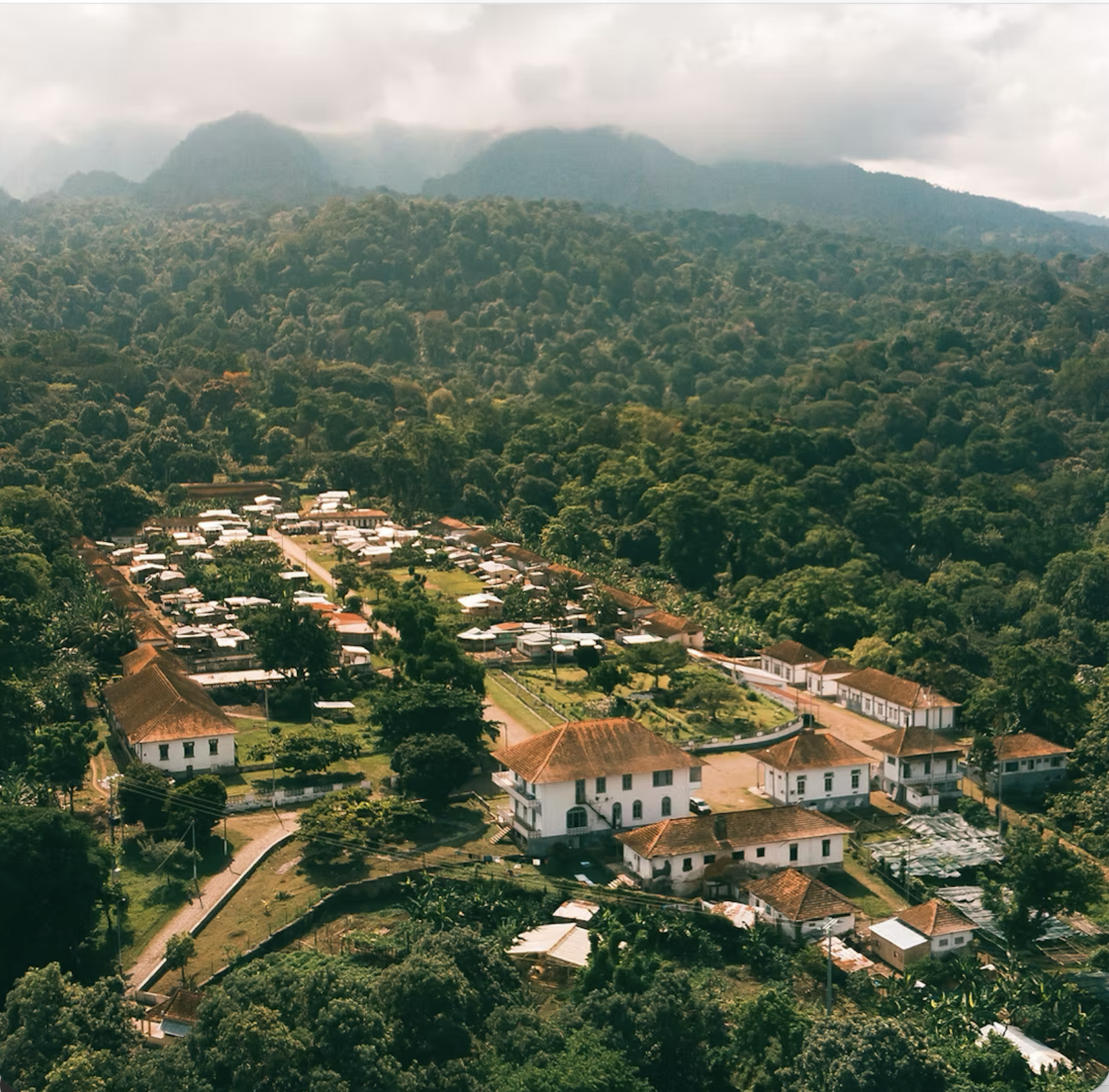 Aerial view of the Roca Diogo Vaz village against Sao Tome's mountains